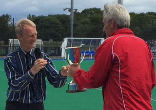 Kieran McLernan presents England Captain Tim Smith with the Linburn Trophy at the Home Internationals at Peffermill 12 July 2015