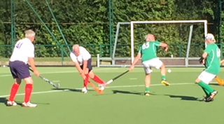 Peter Gordon shoots high at a penalty corner